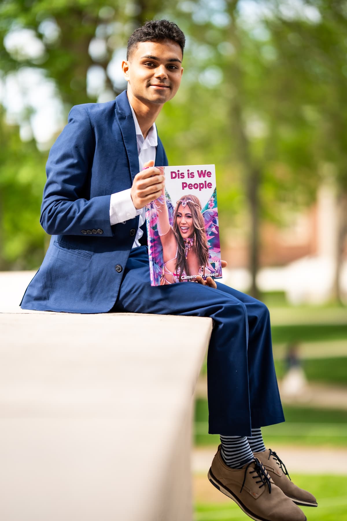 Cameron Hosein with his book 'Dis is We People'