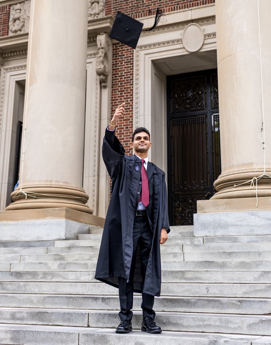 Cameron Hosein celebrating graduation in cap and gown