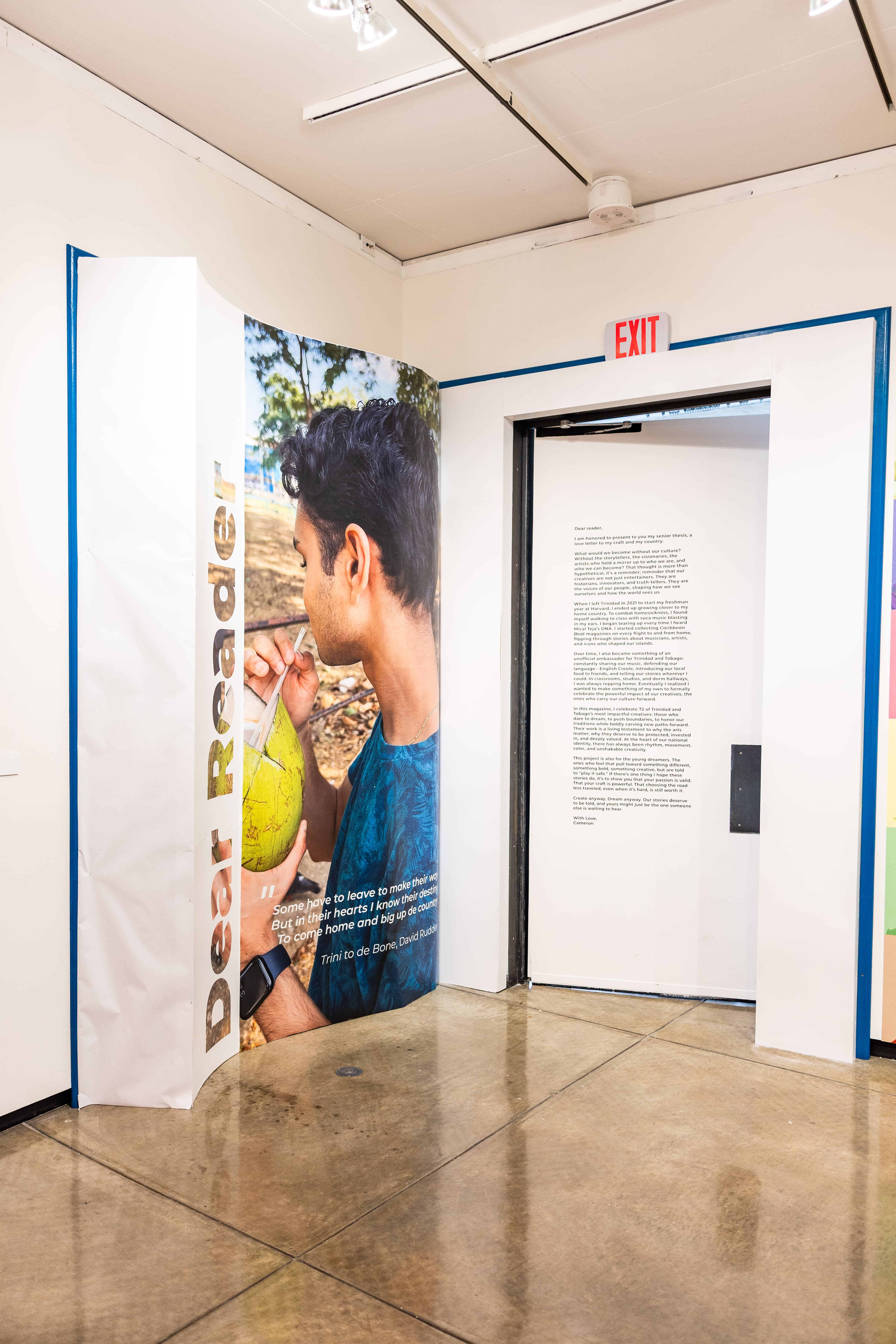 10-foot wooden book sculpture displaying magazine pages with portrait and text