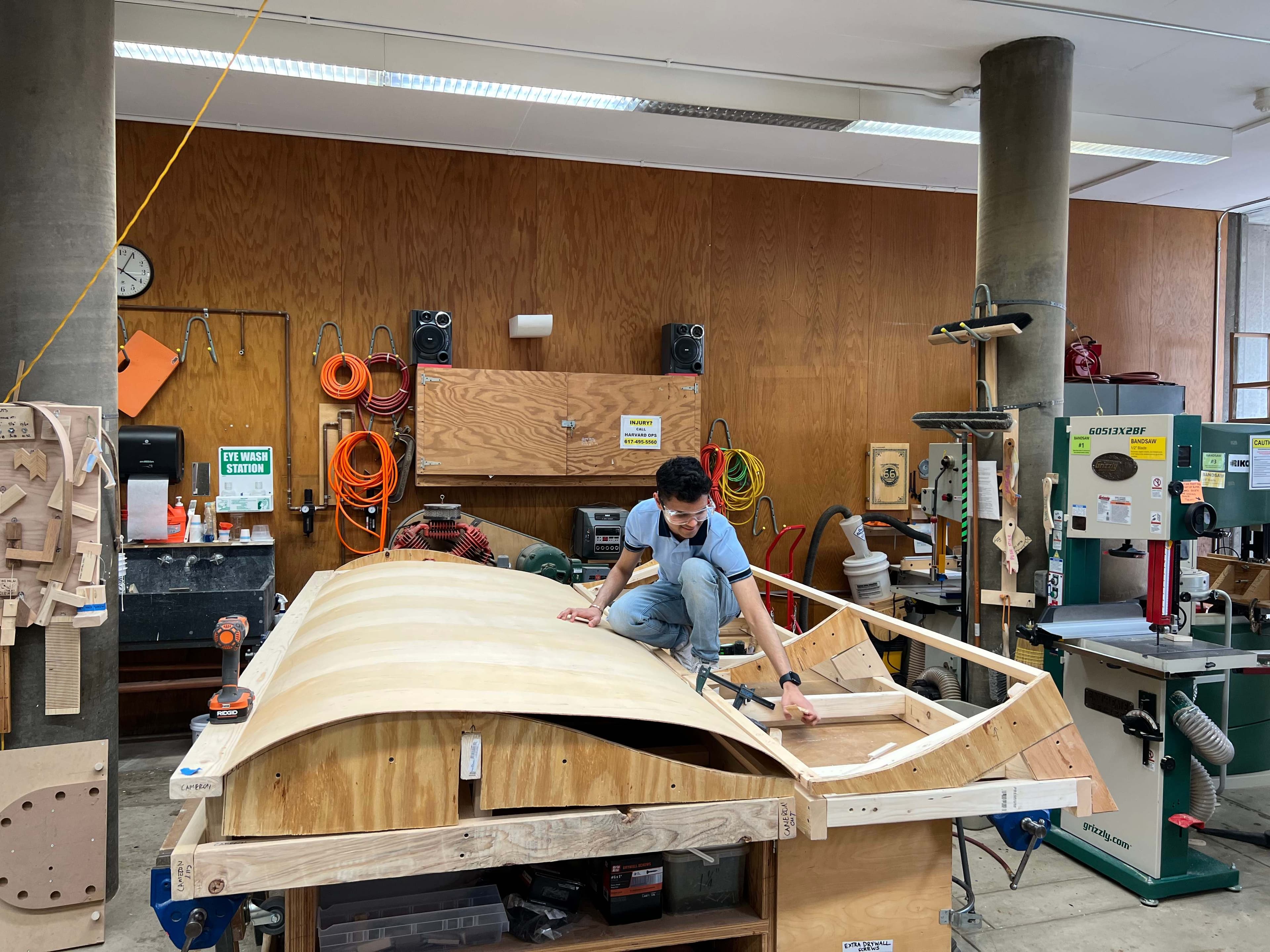 Cameron working in the woodshop constructing the giant wooden book sculpture